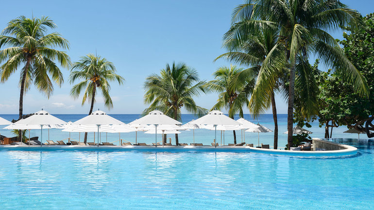 Fun & Festive Warm Weather Destinations That Bring Joy To The Holidays - Image credit Kimpton Grand Roatán Resort & Spa