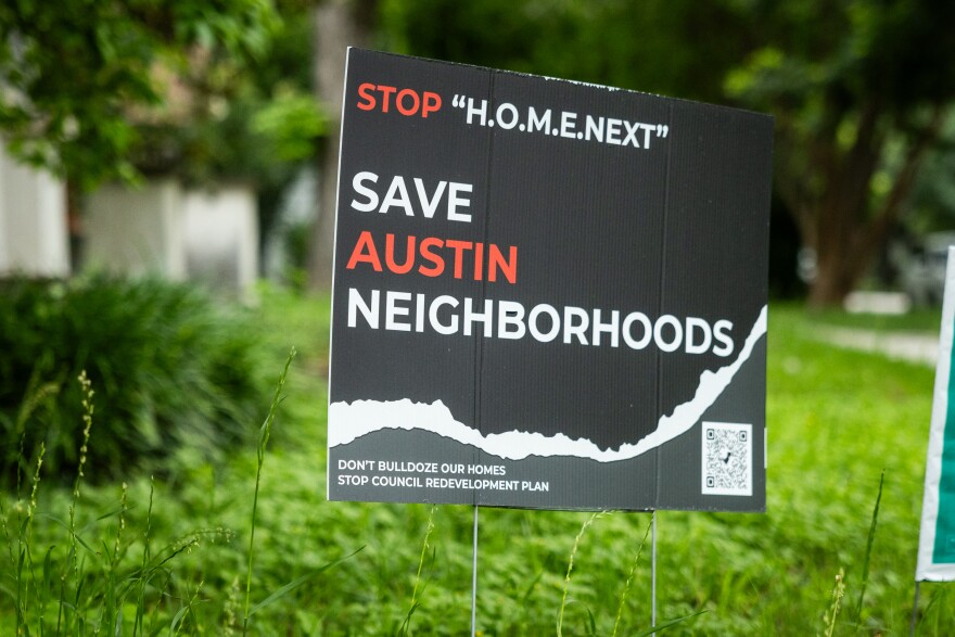 A yard sign that reads "Save Austin Neighborhoods" is shown.