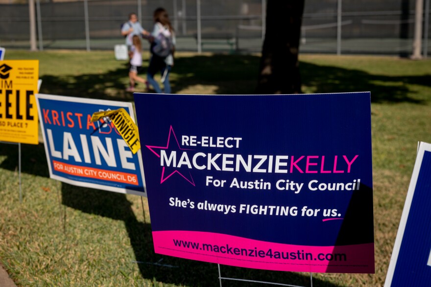 Campaign signs for Austin City Council District 6 are shown.