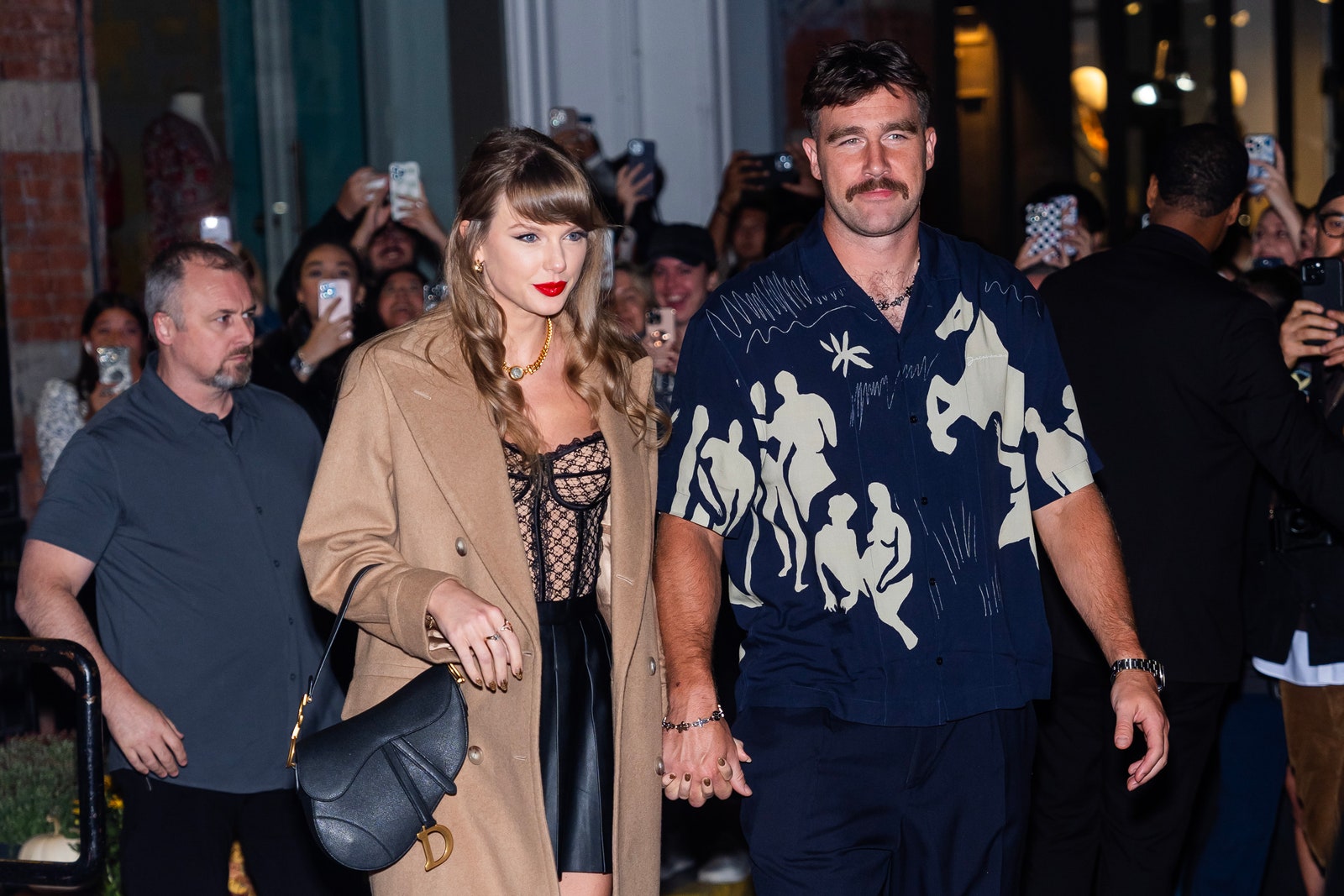 Image may contain Travis Kelce Taylor Swift Adam Liaw Accessories Bag Handbag Adult Person Fashion and Jewelry