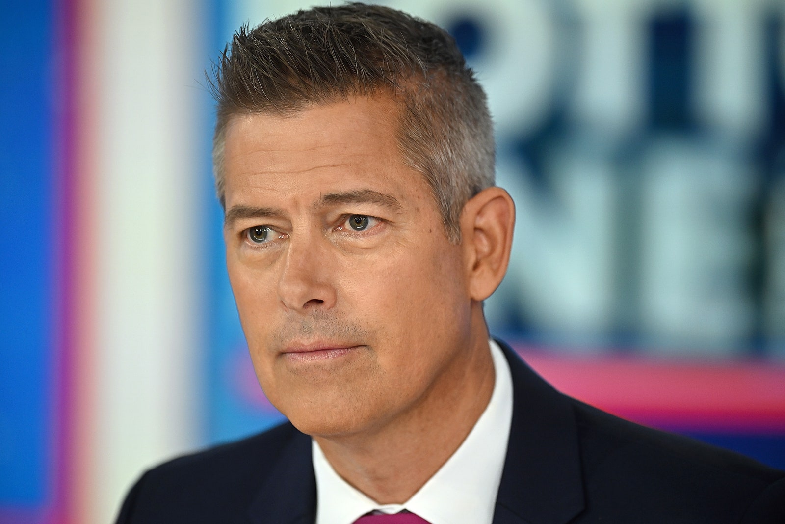 Image may contain Sean Duffy Face Head Person Photography Portrait Adult Accessories Formal Wear Tie and Clothing