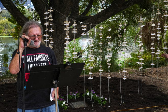 Danny Henderson, a preacher and member of the Austin homeless community, speaks at a memorial service at Auditorium Shores on Sunday, Nov. 17, 2024 in Austin. Advocates and members of the homeless community gathered to honor the more than 200 homeless people that died between September of 2023 and November of 2024.