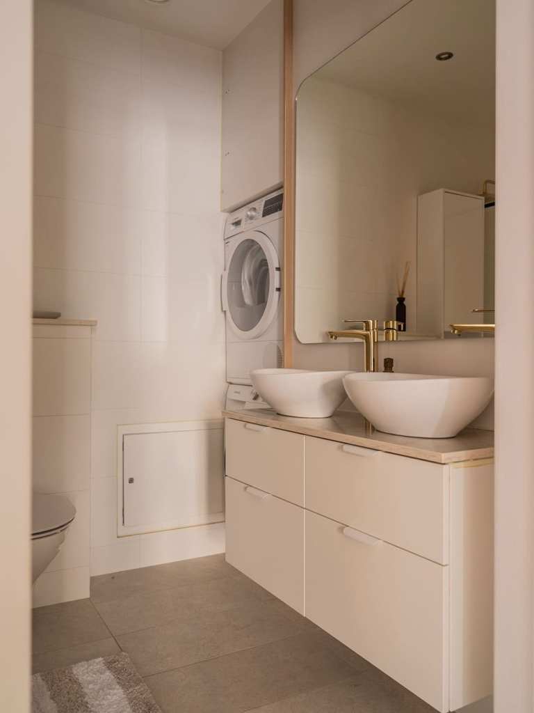 A simple bathroom with gold fixtures