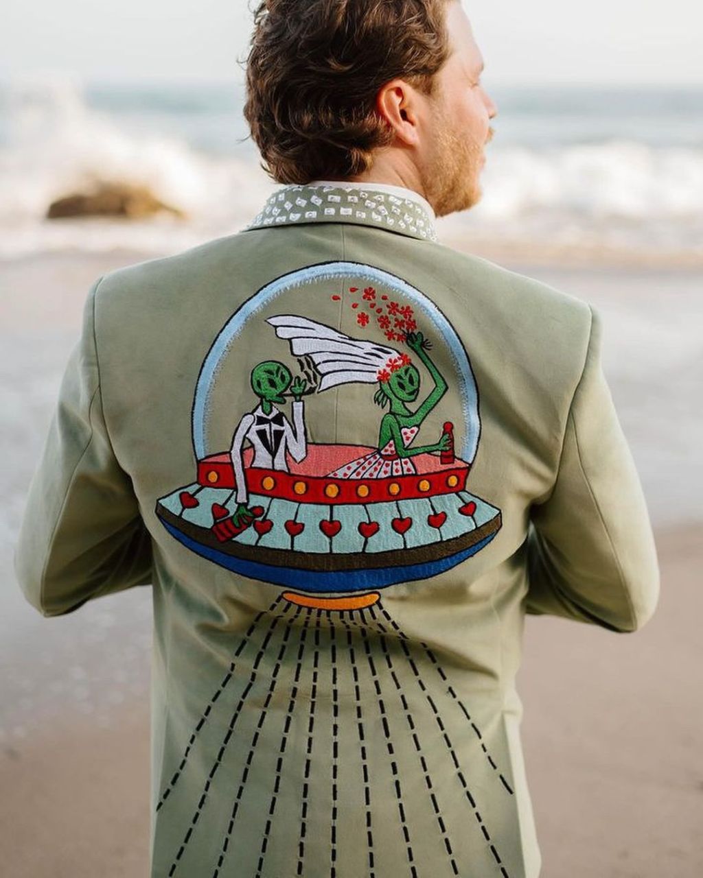 unique customized western sage green suit jacket with unique alien themed embroidery on the back designed by Addicted Bespoken 