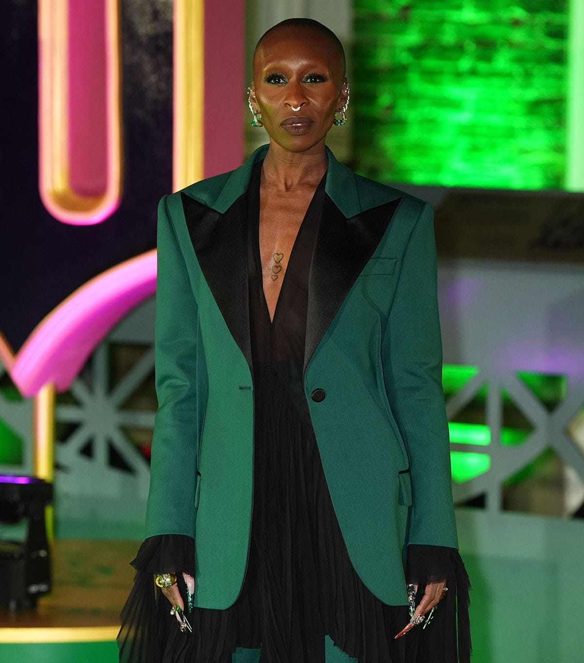 Cynthia Erivo complements her green outfit with shimmering emerald eyeshadow and mauve lip color