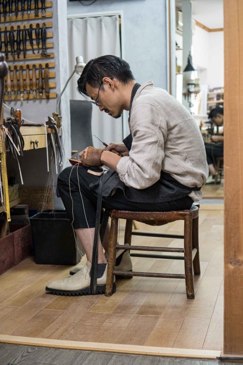 Wataru at his workbench.