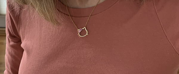 A Hello Kitty pendant in gold and diamonds