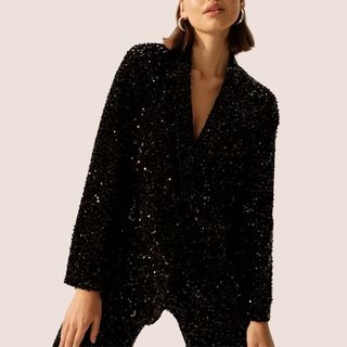 flat lay image of woman wearing sequin blazer