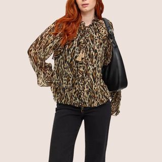 flat lay image of woman wearing leopard print blouse