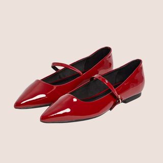 flat lay image of red ballet pumps