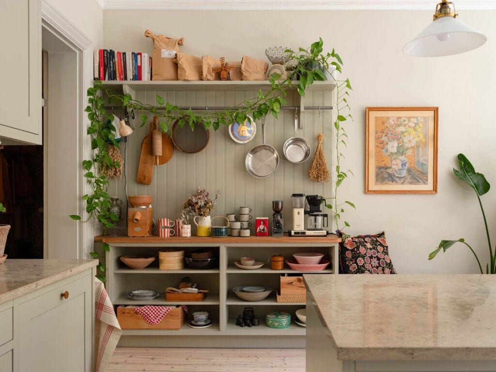 Painted sage green furniture in a cozy kitchen with sage green cabinets