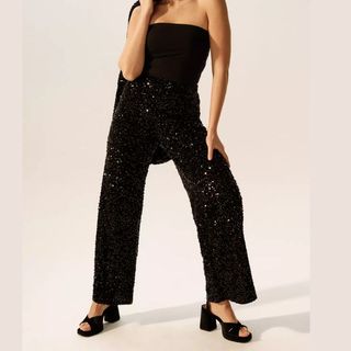 flat lay image of black sequin trousers