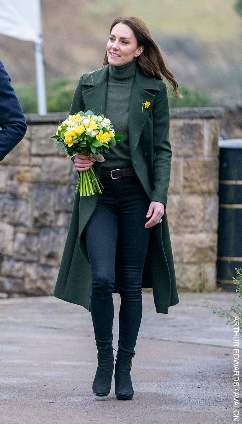 Kate Middleton shows how skinny jeans can still chic in cooler weather, paired with a long coat, knitwear and boots.