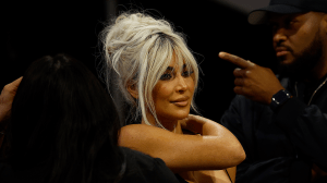 Kim Kardashian with silver hair in an updo.