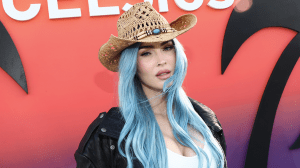 Megan Fox at Coachella with long pastel blue hair.