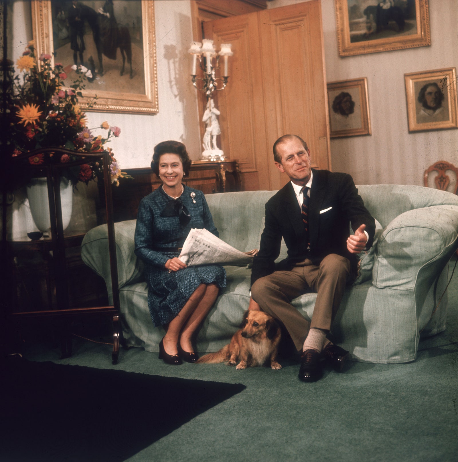 Image may contain Philip Tomalin Elizabeth II Couch Furniture Plant Potted Plant Blazer Clothing Coat and Jacket