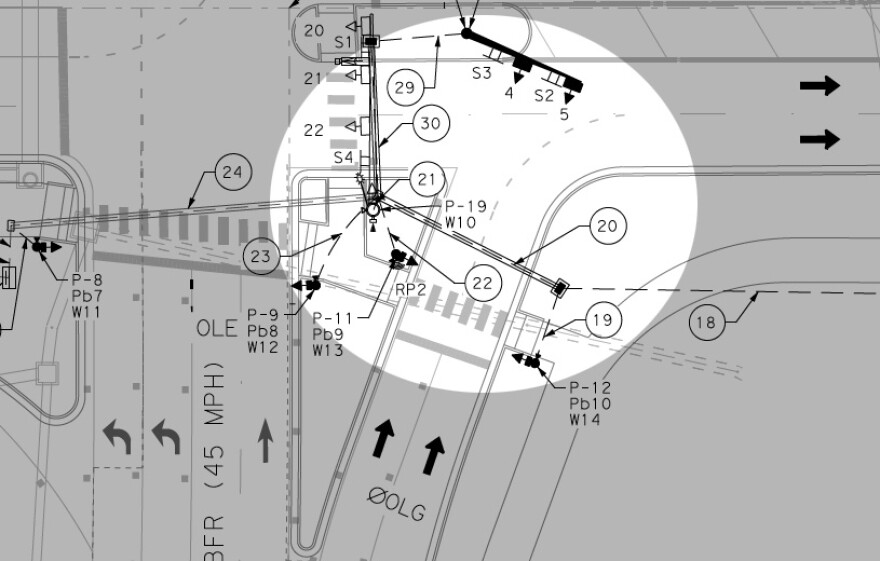 A detailed engineering schematic of I-35 at Grand Avenue, showing lane configurations, turn lanes, crosswalks and signal placements. The intersection in question has been highlighted by KUT.