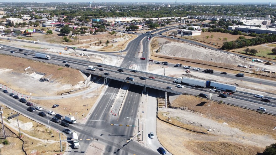 An aerial view of Wells Branch Parkway at I-35 with signs of recent construction activity. 