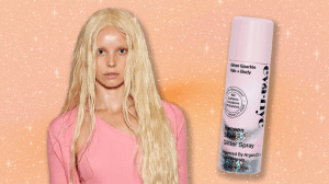 A Blumarine model with sparkly hair and skin next to the Eva NYC Kweeen Glitter Hairspray.