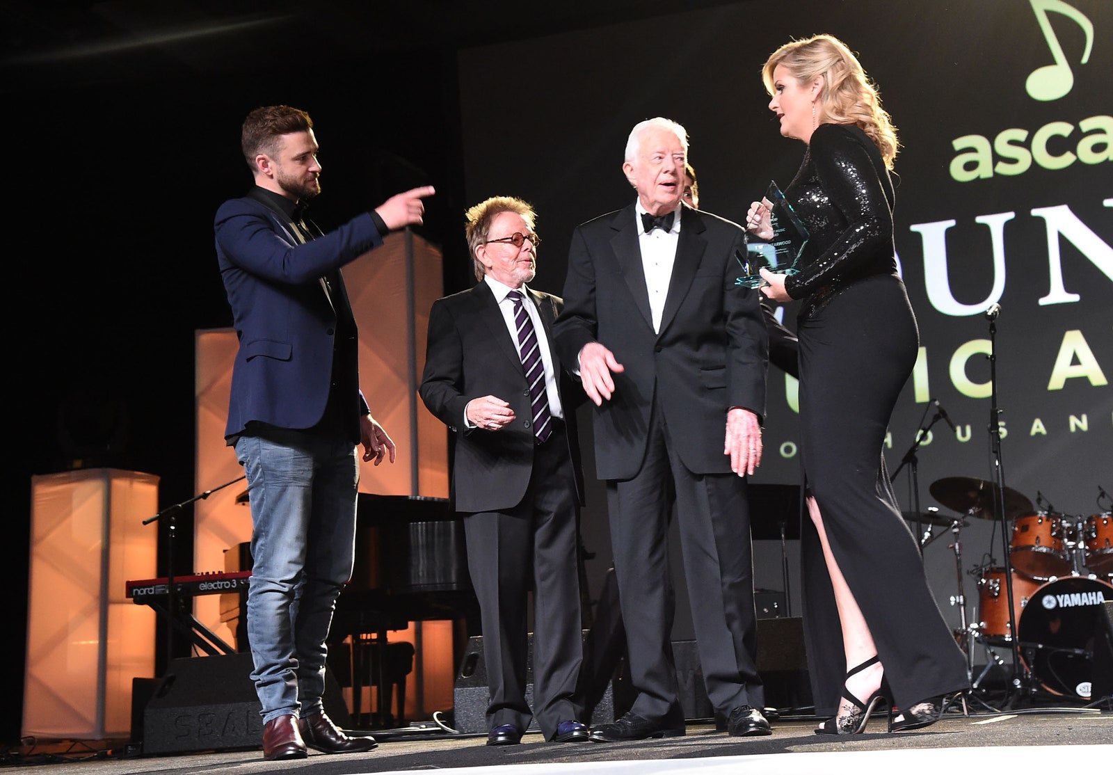 Image may contain Jimmy Carter Marcus Prinz von Anhalt Trisha Yearwood Justin Timberlake Stage and Accessories