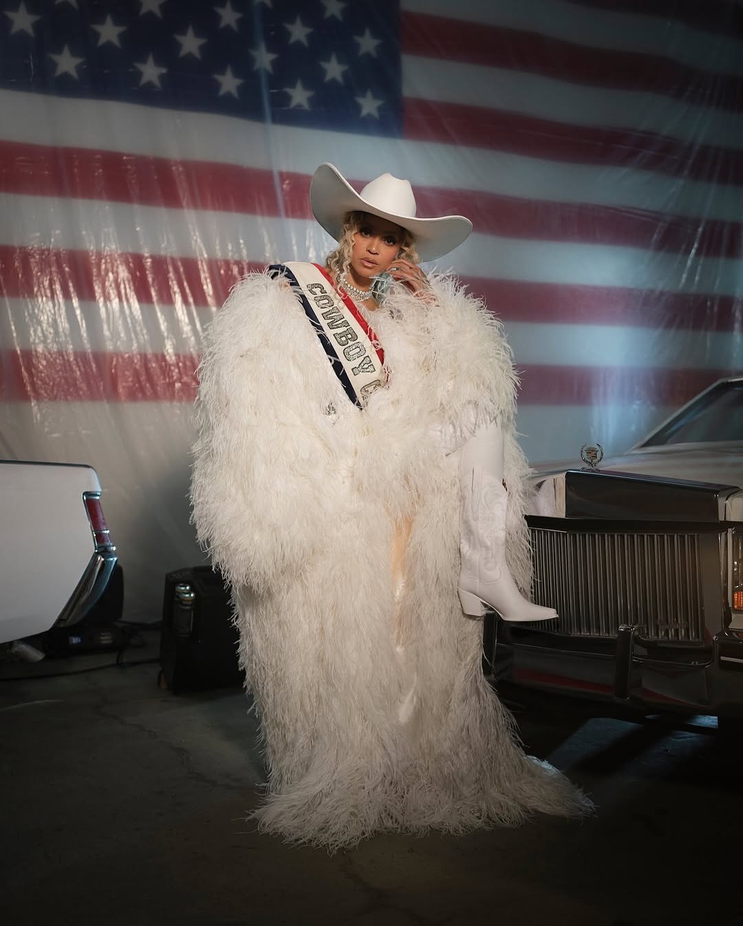 9 Beyonce Wears Custom Roberto Cavalli Couture White Feather Look And An ASN Cowboy Hat While Blue Ivy Wears Custom Frolov Heart And A Stetson Hat To Perform For NFL Halftime On Christmas Day