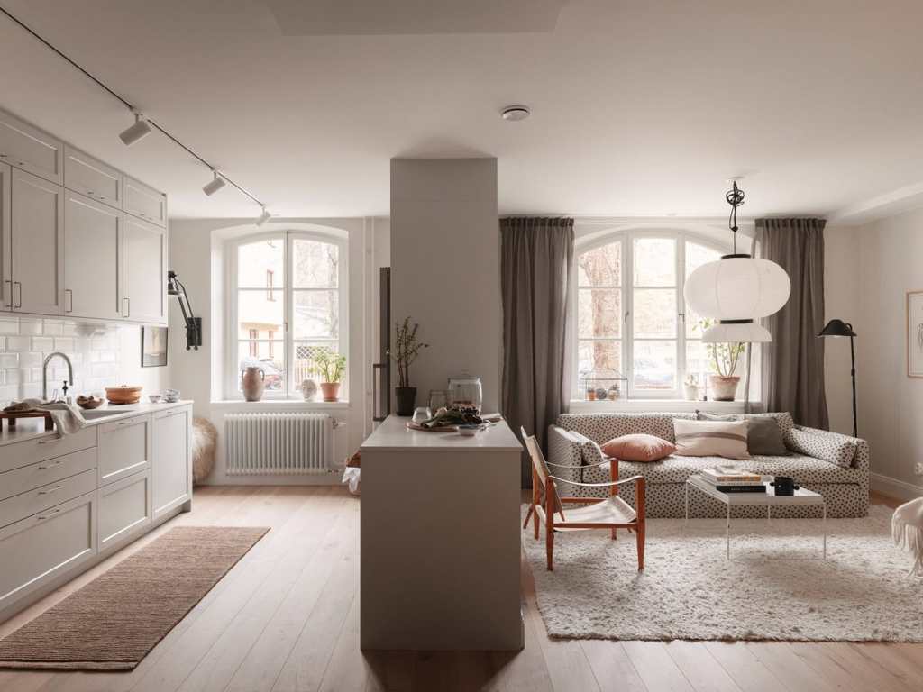 A living kitchen with a kitchen island separating the different functional areas