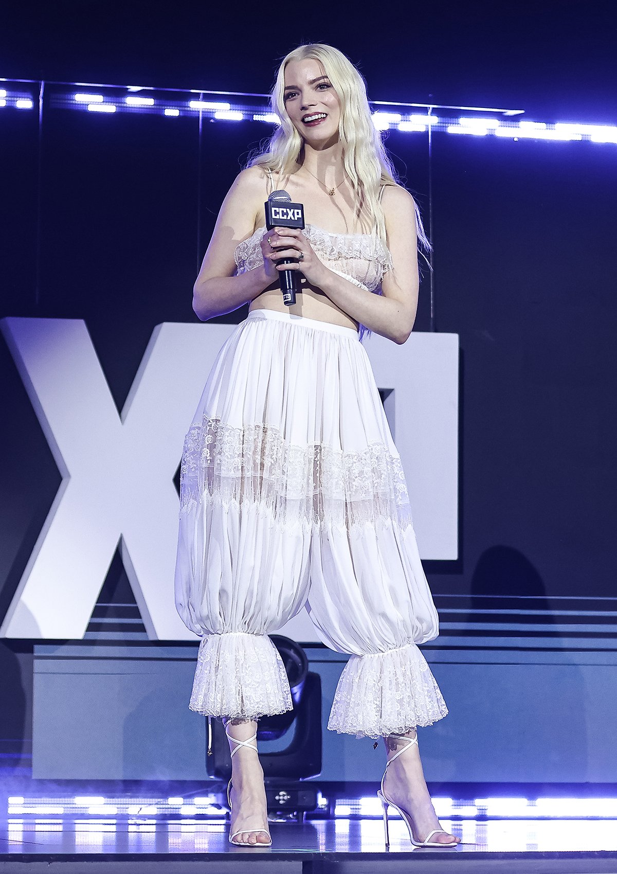 Anya Taylor-Joy teams a tiny lacy bralette by Chloe with matching pantaloons featuring a high waist, sheer lace trims, and gathered frilled cuffs