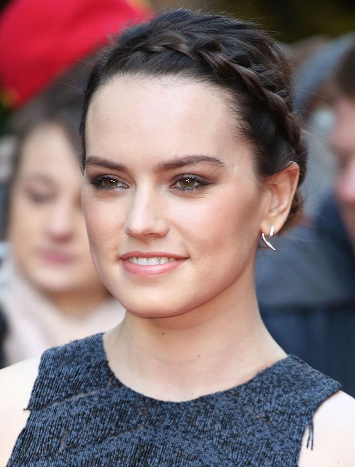 Daisy Ridley braids her hair for the 2016 Jameson Empire Film Awards