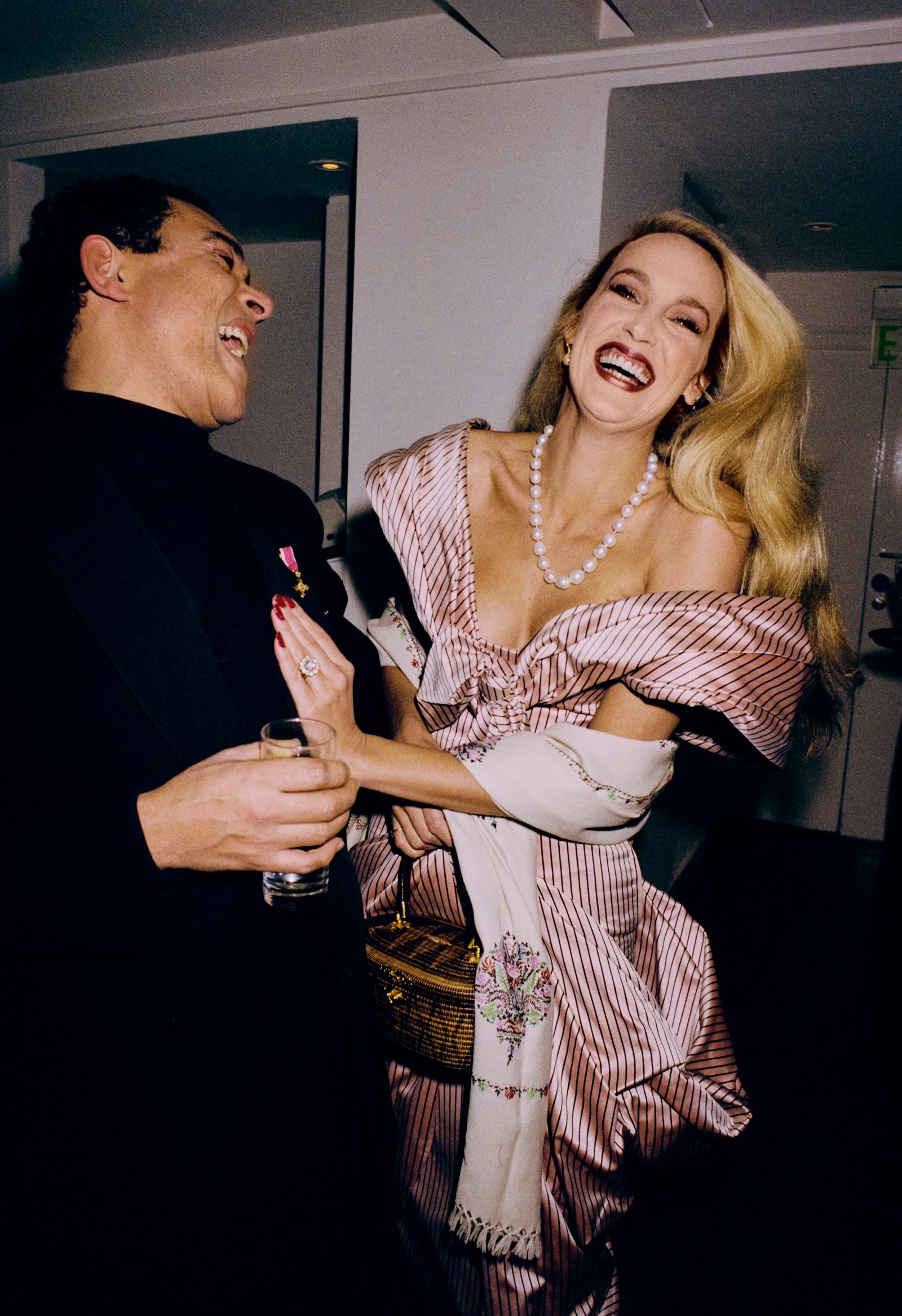 Image may contain Jerry Hall Accessories Jewelry Necklace Clothing Dress Blazer Coat Jacket Formal Wear and Head