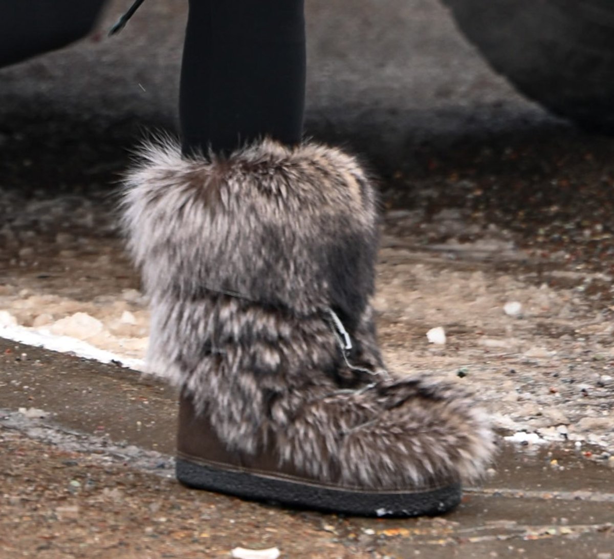 Jennifer Lopez completes her apres-ski outfit with Brunello Cucinelli fox fur shoes