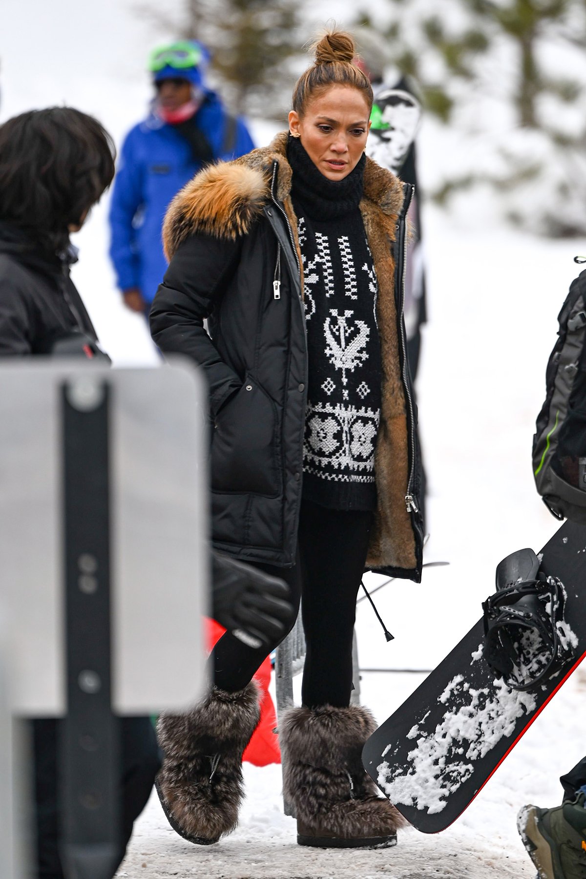 Jennifer Lopez looks cool in her black-and-white Moncler cable-knit sweater dress and leggings combination