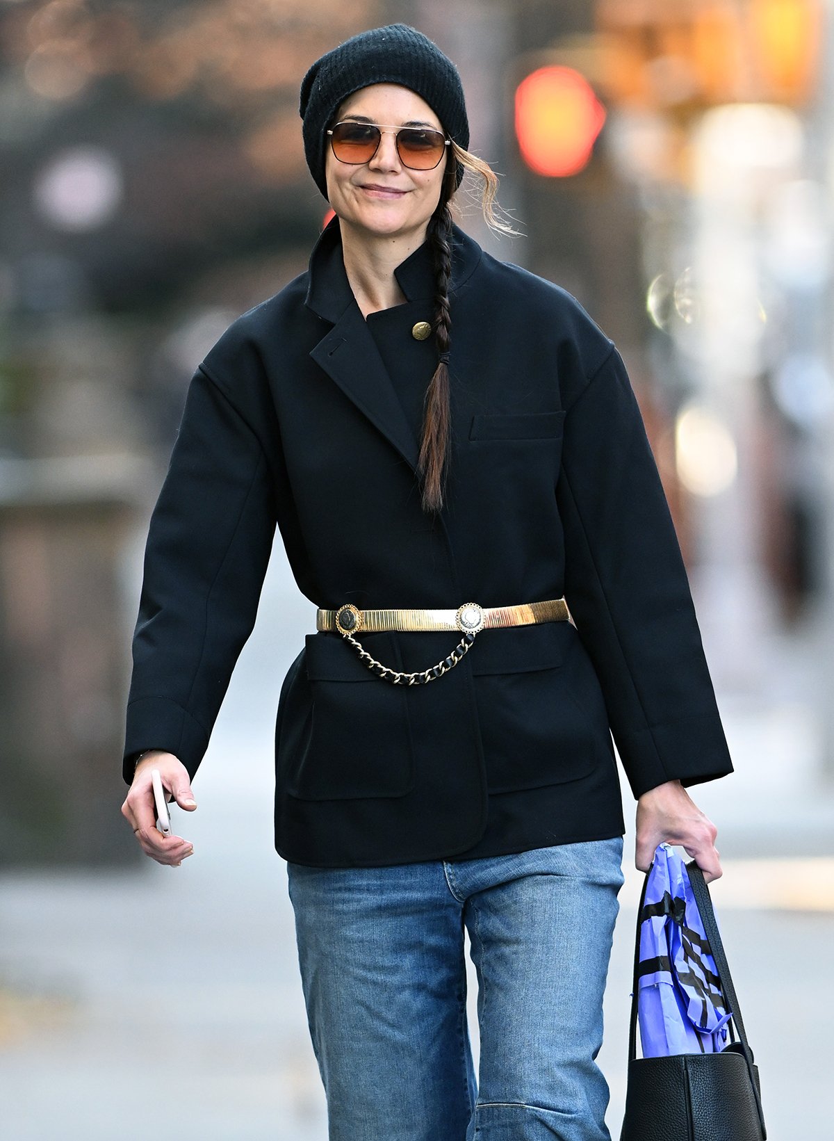 Katie Holmes completes her winter chic outfit with a beanie, adding a dash of comfy flair to the look