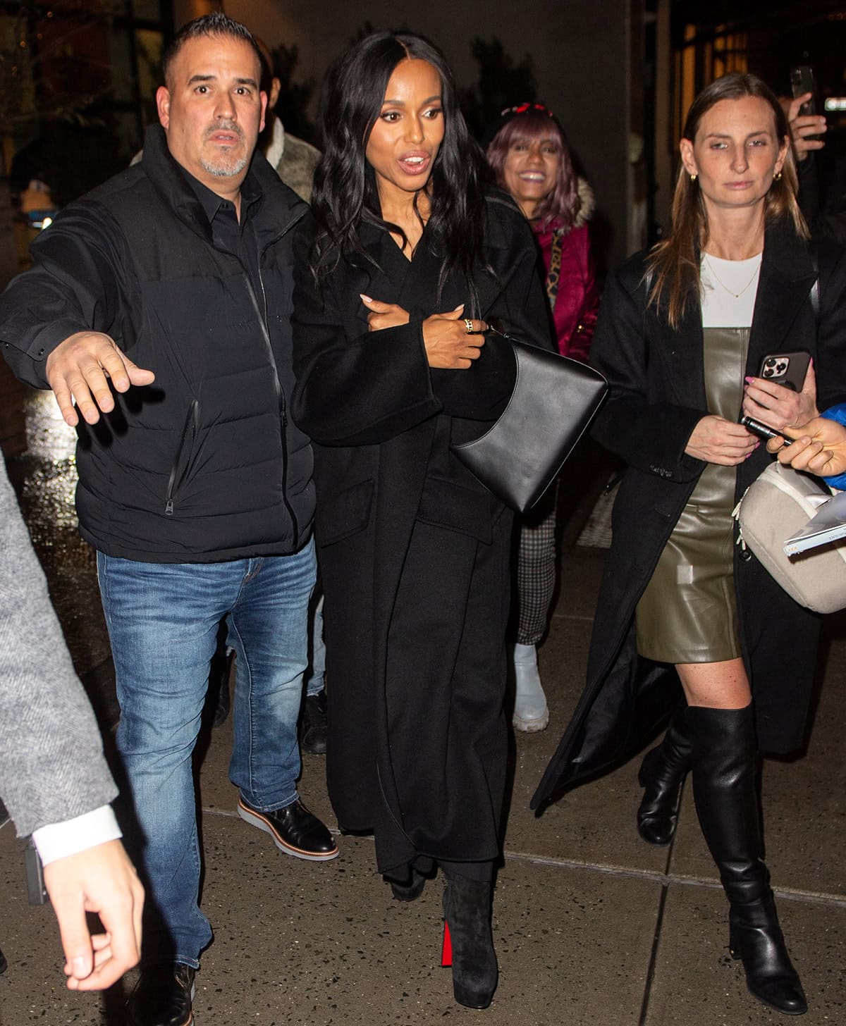 Kerry Washington looks cozy in a black coat ahead of The Six Triple Eight premiere at The Crosby Hotel