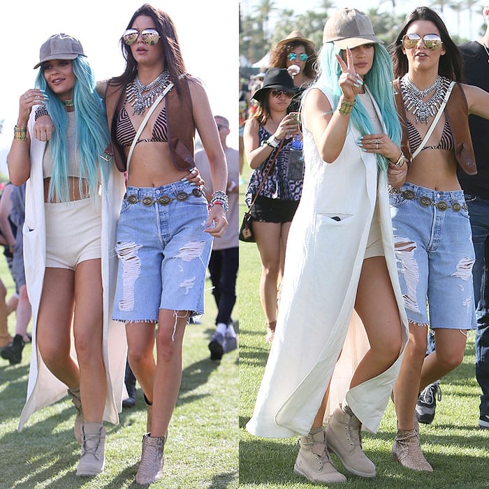 Kylie Jenner brings festival vibes with off-white Timberland boots, a flowing long vest, and bright aqua hair, perfectly complementing Kendall's boho-chic denim look