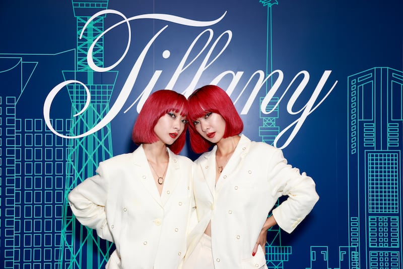 Fashion influencers Ami and Aya Suzuki, Japanese twin sisters and singers known by their stage name Amiaya, attend the opening event of jeweller Tiffany & Co.'s Omotesando store opening in Tokyo, Japan in September 2023.