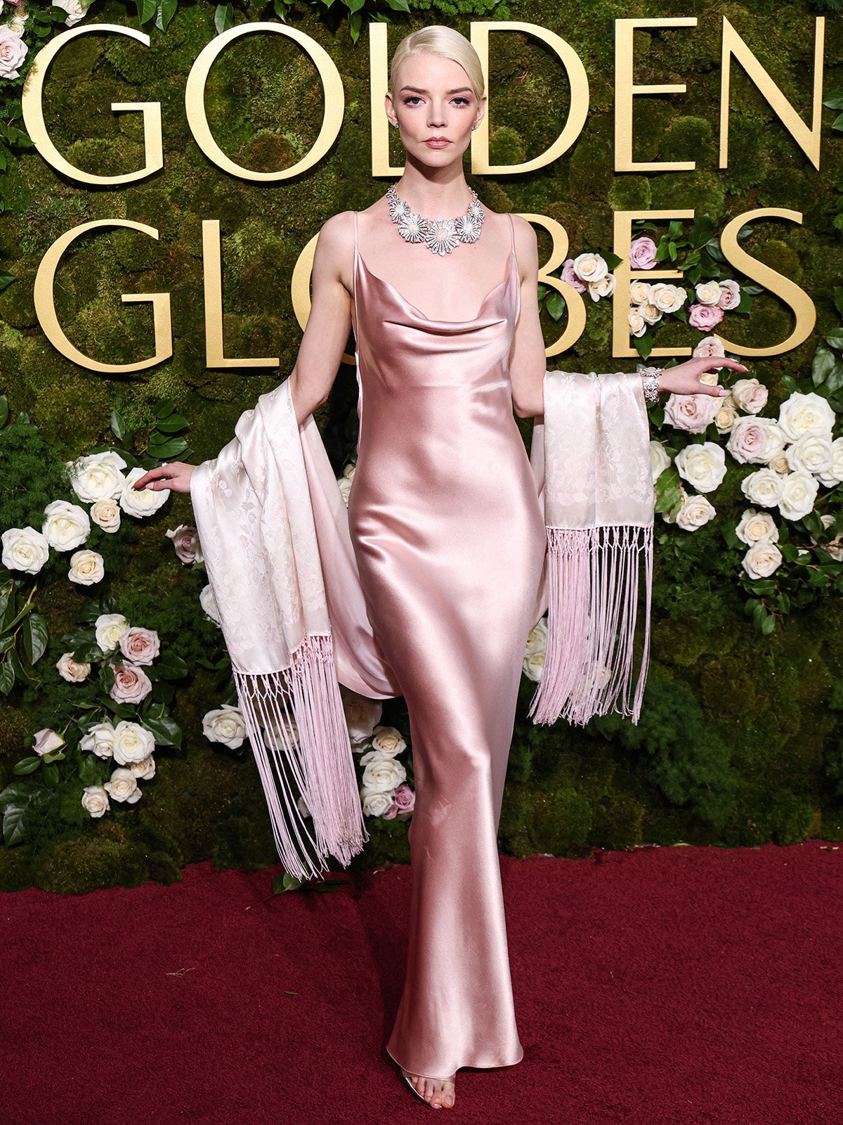 Anya Taylor-Joy channels the 1960s in an archival pale-pink Dior Couture slip dress with a draped cowl neckline