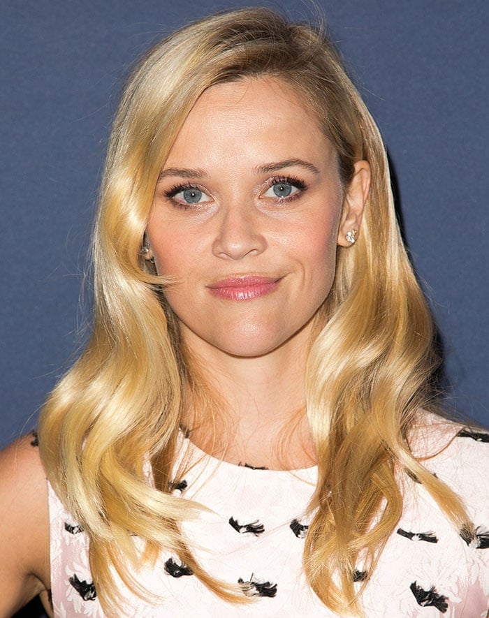 Reese Witherspoon radiates elegance with her soft blonde waves and striking blue eyes at Variety's Power of Women Luncheon