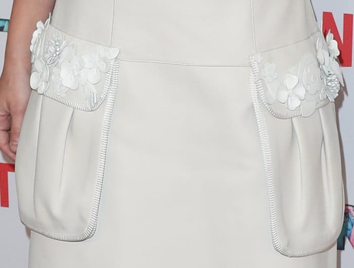 These pockets are too big and bulky for the lovely white dress