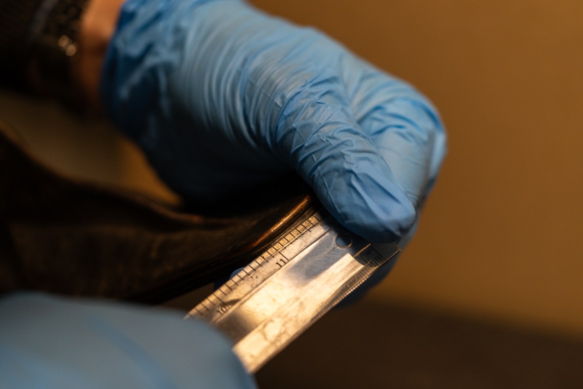 Checking stitch density.