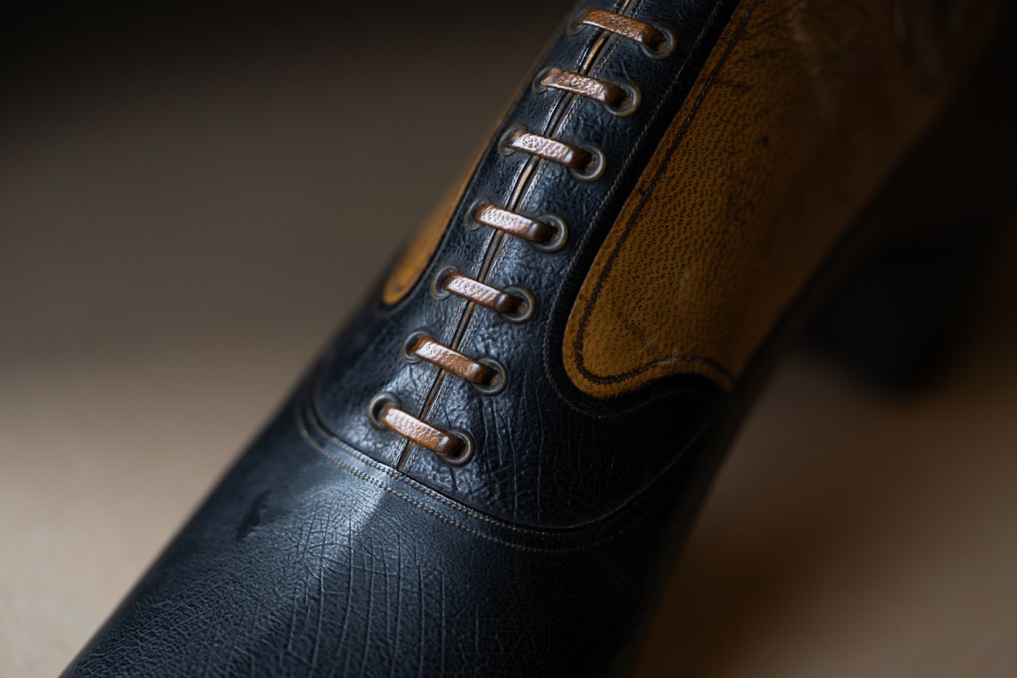 Faux lacing with leather laces.