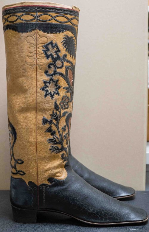 Beaded side seam with red leather piece.